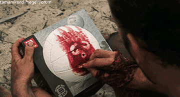 Chuck from &quot;Cast Away&quot; painting Wilson&#x27;s face on his volleyball body