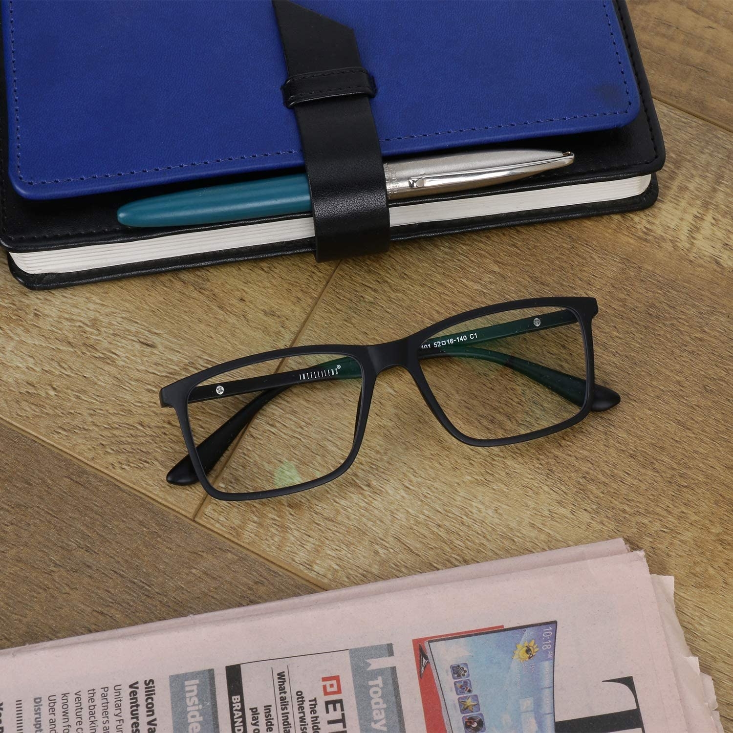 A pair of blue light blocking glasses on a table 