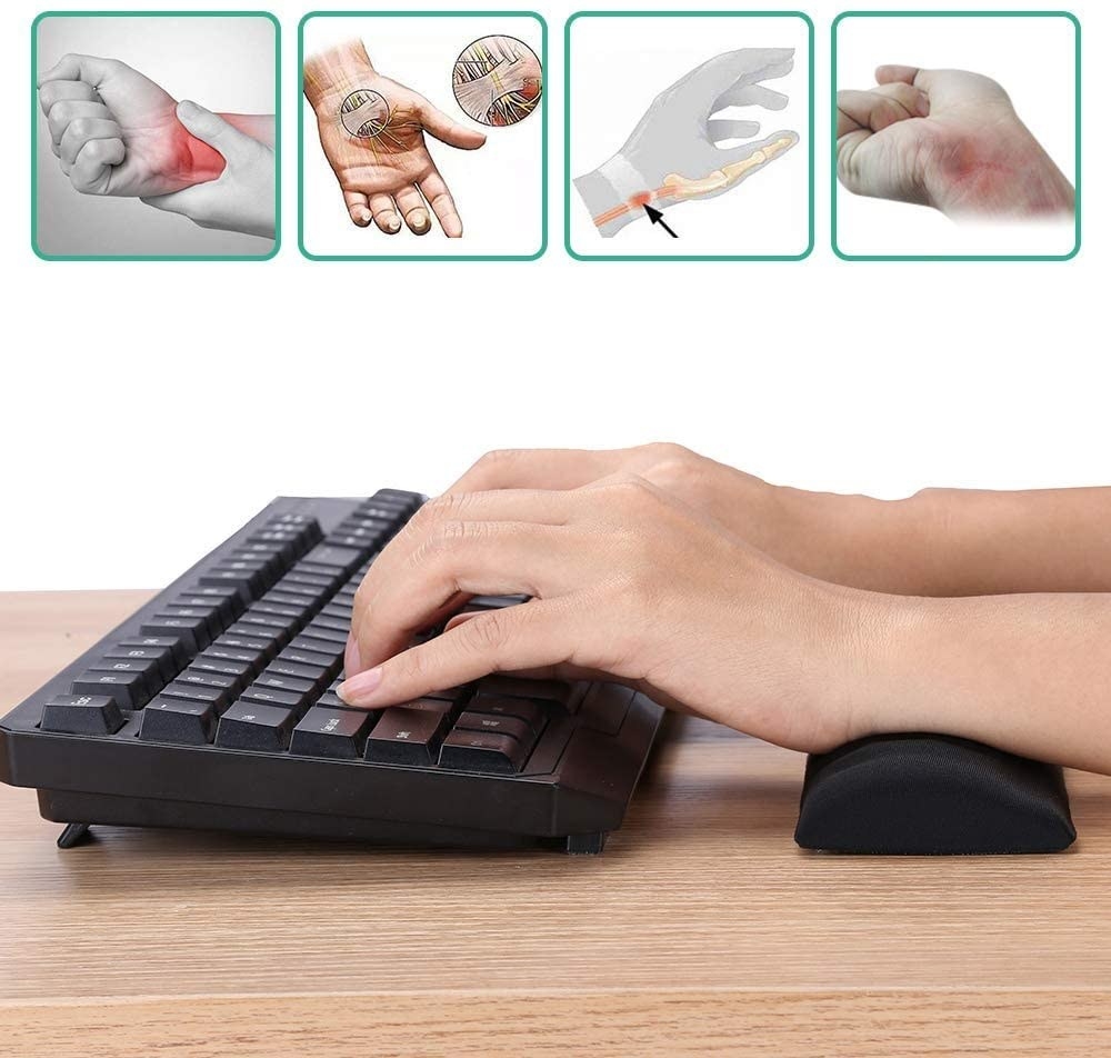 A person typing with the memory foam wrist pad 