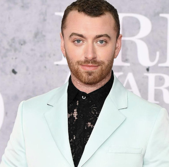 Sam Smith in an ice-blue suit
