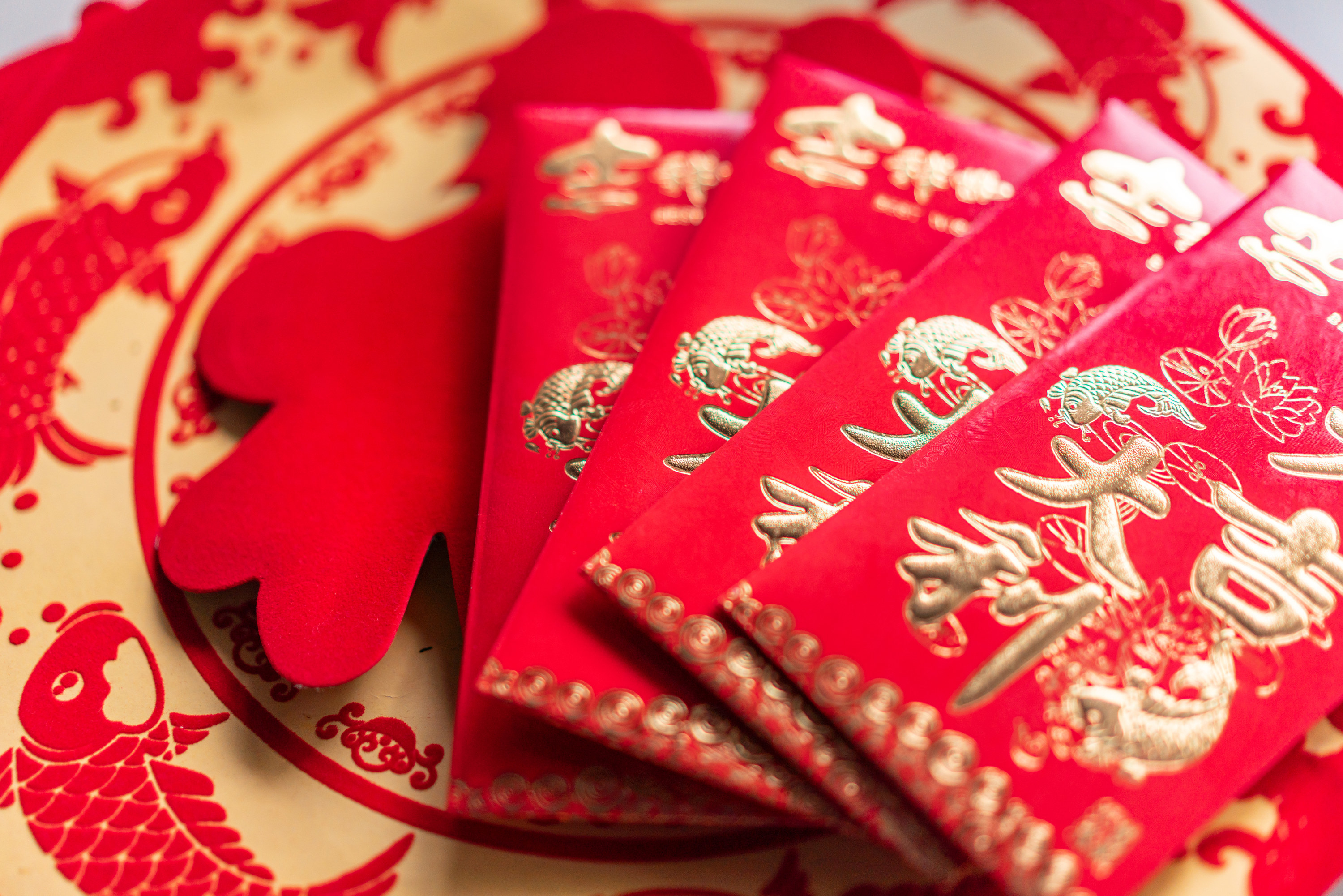 Closeup of a pile of lucky red envelopes that normally hold money
