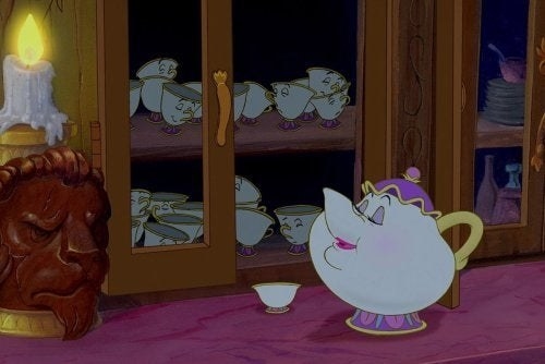 Mrs. Potts putting Chip to bed in the cupboard