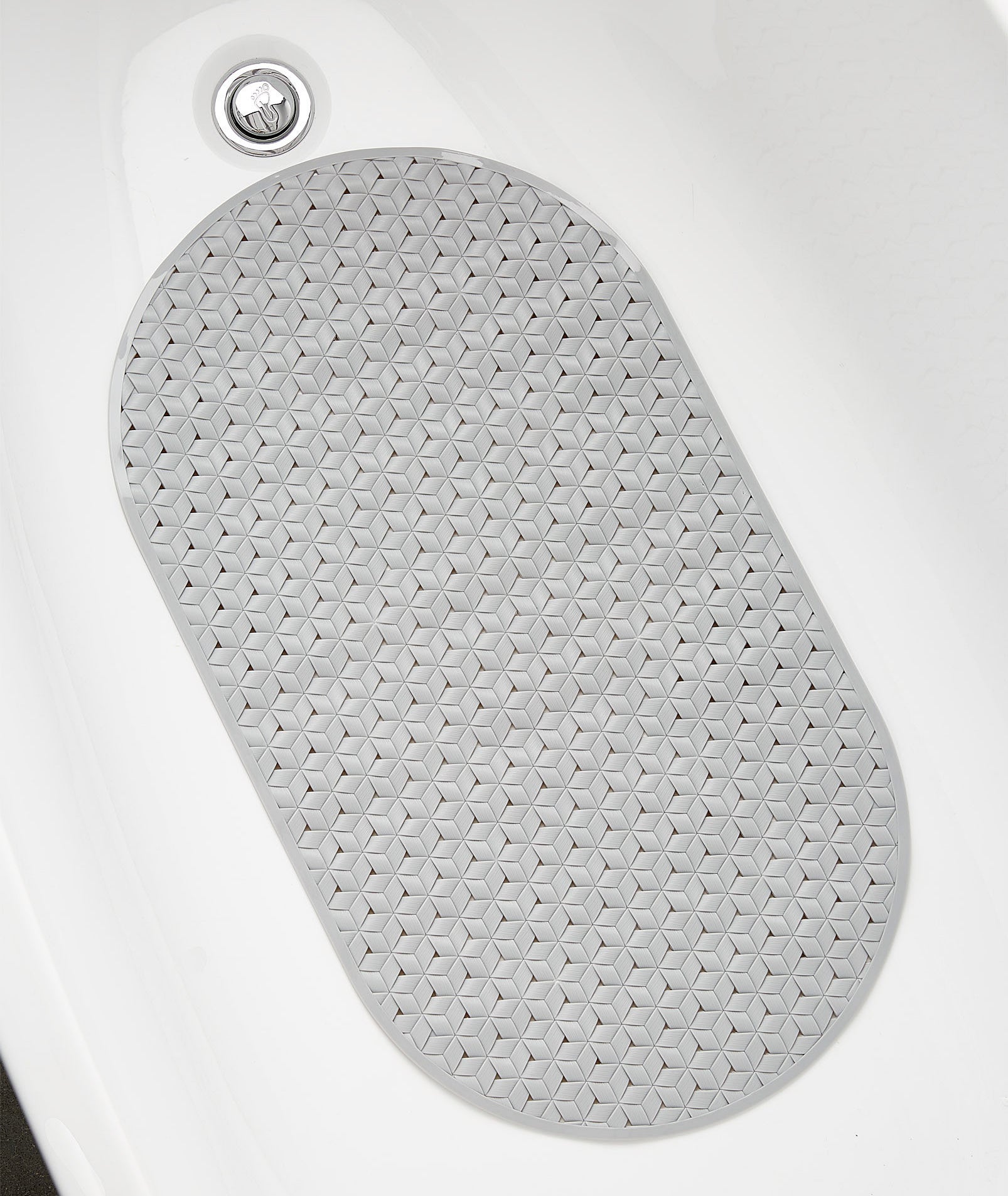 A top down view of the woven silicone bath mat inside a tub