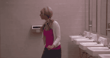 Sharpay walks right by Gabriella in the restroom