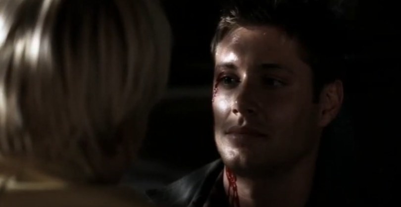 A bloodied Dean Winchester staring at Meg