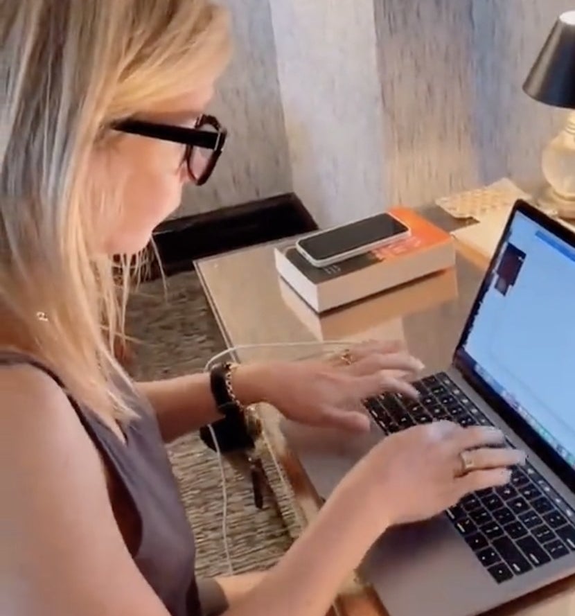 Gwyneth types at her laptop