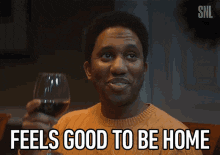 Chris Redd with wine saying feels good to be home