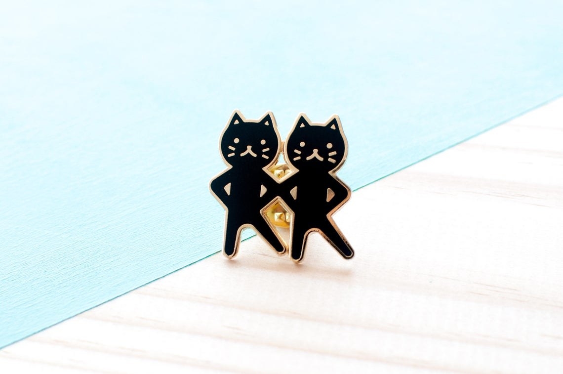 pin of two cats dancing 