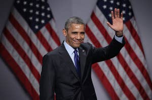 Obama waves at a summit in 2015