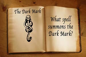 a spell book containing a drawing of the dark mark
