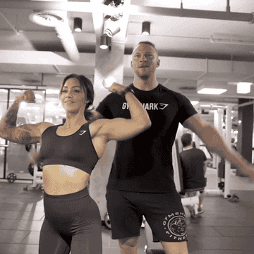 Man and woman bodybuilders flexing biceps