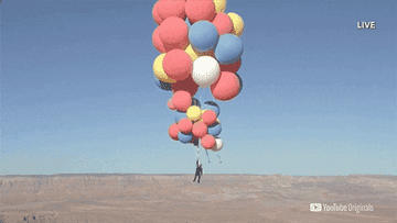 David Blaine suspended in the sky by giant balloons