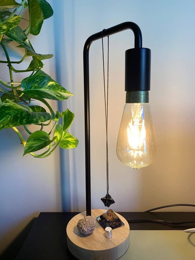 a desk lamp with an exposed bulb