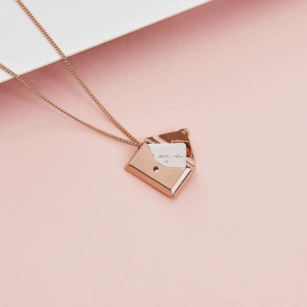Envelope pendant necklace with note inside that says &quot;I love you&quot; 