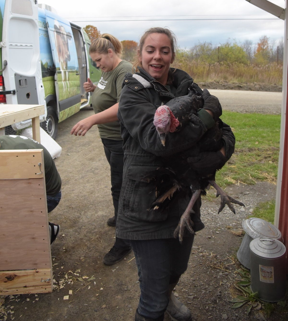 a woman holding a turkey