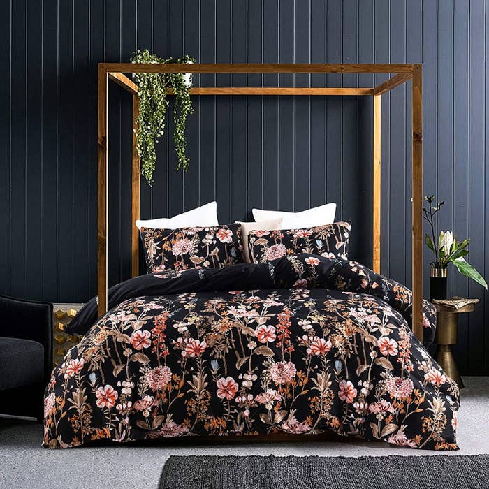 a black comforter with pink florals on it