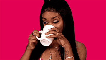 GIF of Dreezy sipping a mug and looking to the side