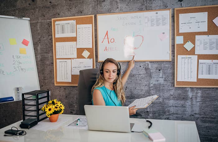 A teacher holding an online class for e-learning students