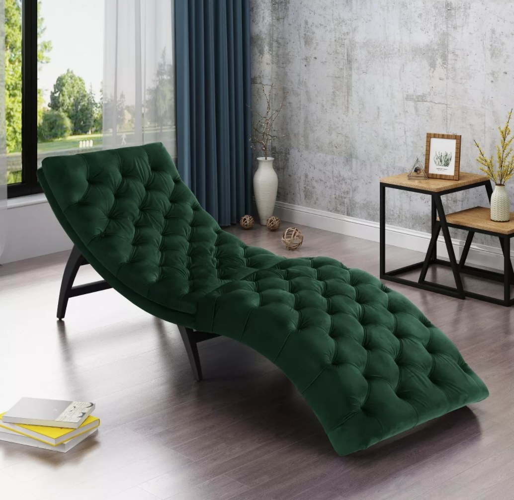 The chaise lounger in dark green in an office space