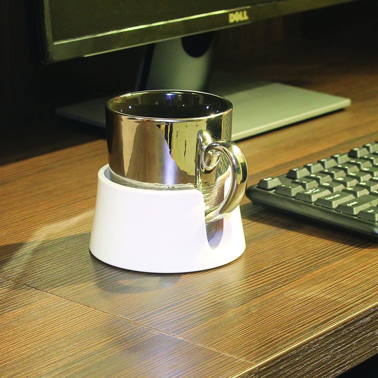 The holder with a mug in it on a desk