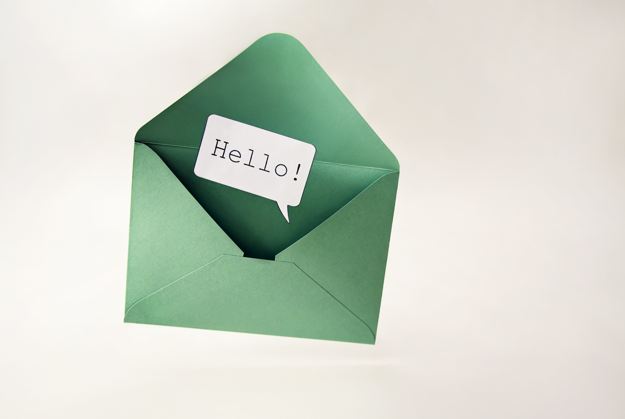An envelope with a speech bubble that says, &quot;Hello!&quot;