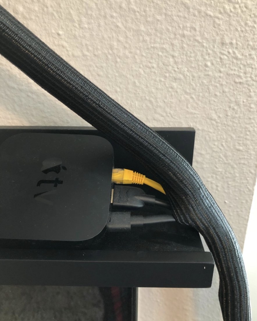 Reviewer photo of a cord protector over cables