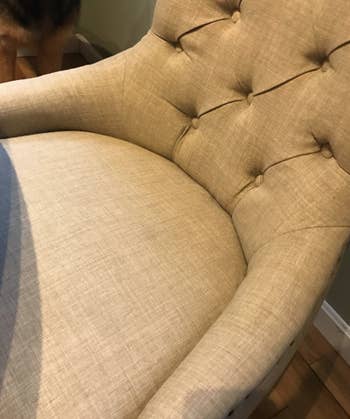 An reviewer after photo of a chair without fur on it