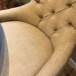 An after reviewer photo of a chair without fur on it