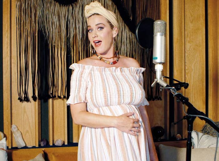 Katy holds her baby bump before giving birth