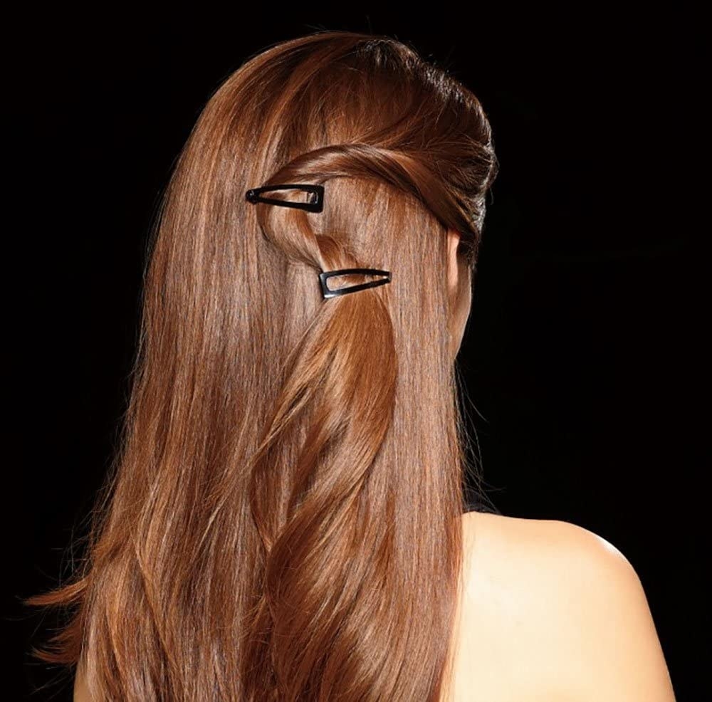 A person with two clips in their hair