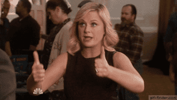 Leslie Knope giving you two big thumbs up with a sweet, excited smile