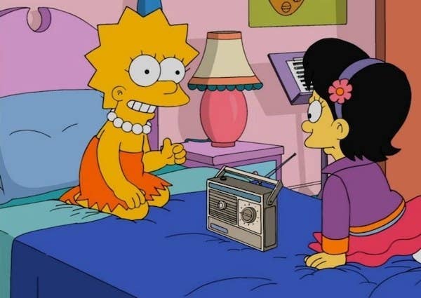 Lisa from "The Simpsons" listening to the radio with a friend in her bedroom