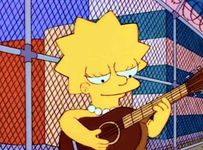 Lisa Simpson from "The Simpsons" playing the guitar