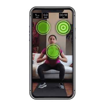 Gif of model squatting with medicine ball to hit targets on a phone screen