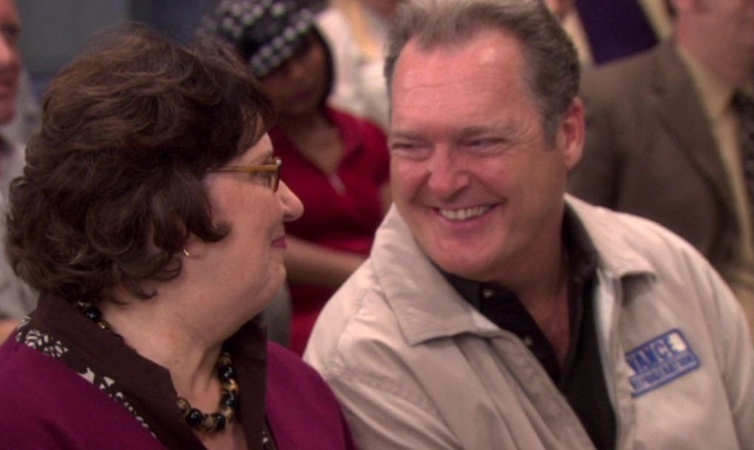Bob and Phyllis staring into each other's eyes and smiling