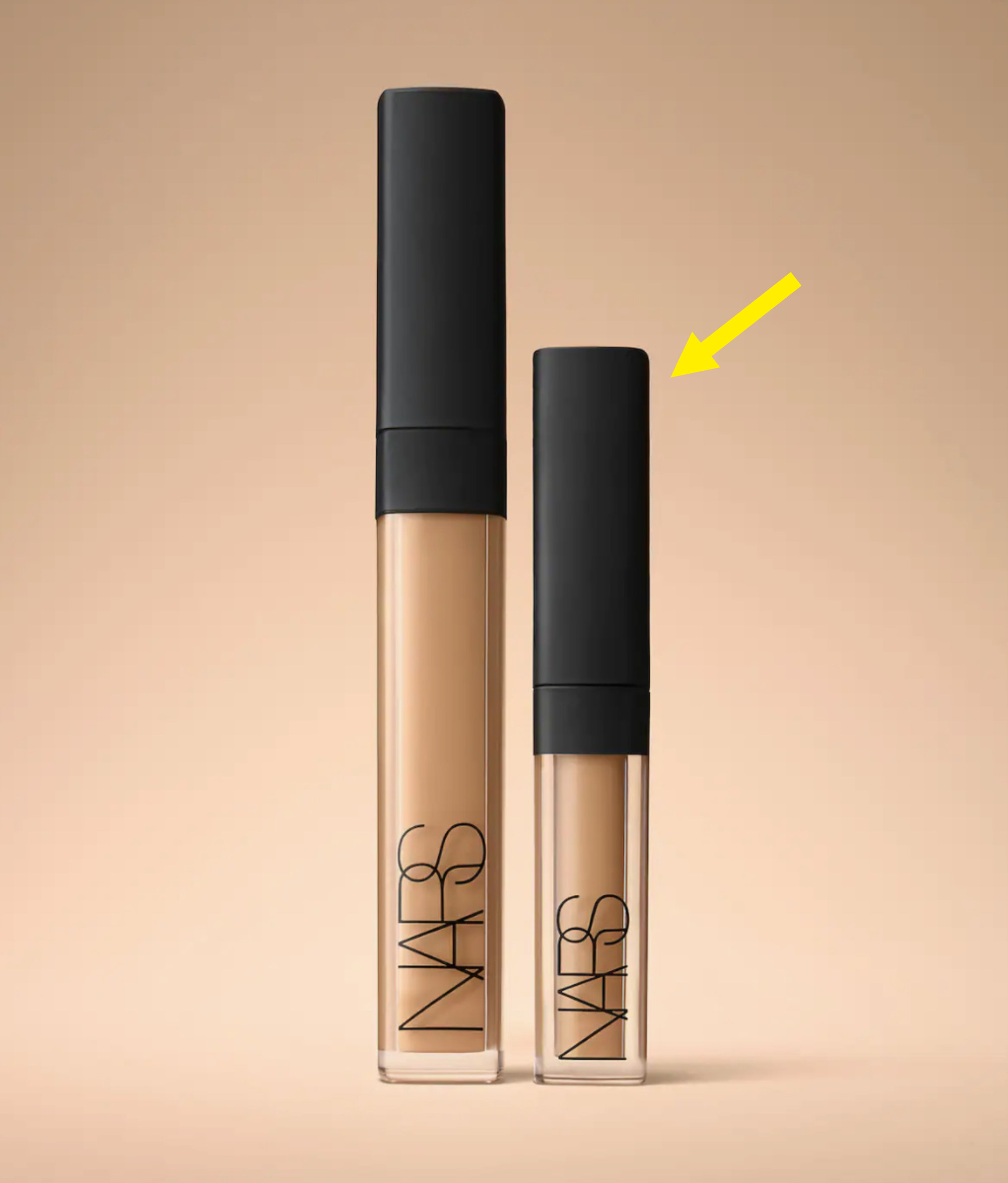 the regular sized concealer and the mini next to each other with an arrow pointing to the smaller one
