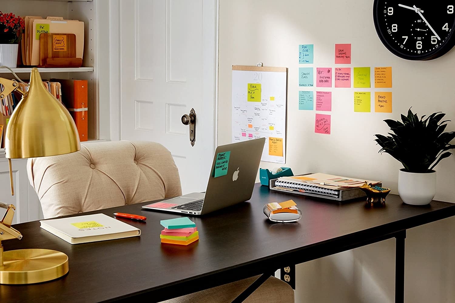 an office with post it notes on the wall