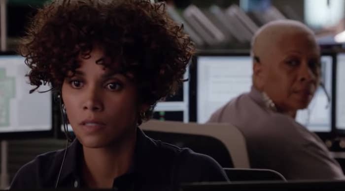Halle Berry listens to an intense call