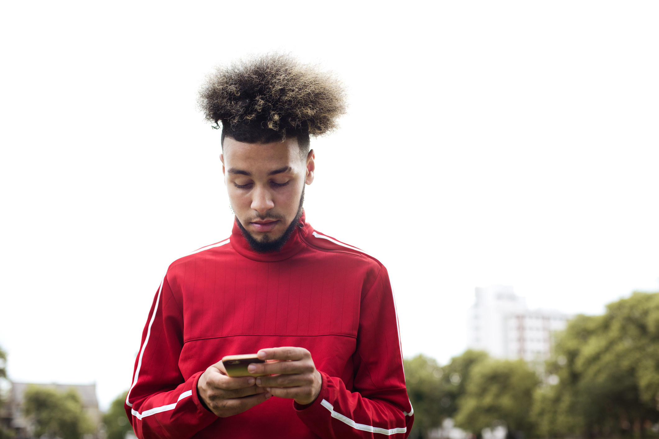 A young man texting