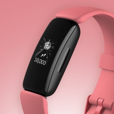 A pink Fitbit activity tracker