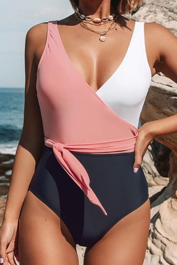 A model wearing the suit in pink white