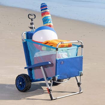 The chair in wagon form filled with various beach items 