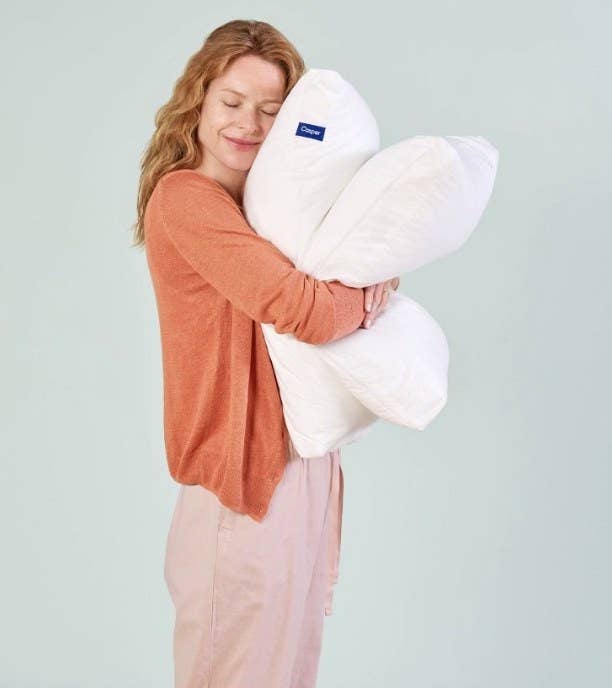 A model hugging a memory foam pillow