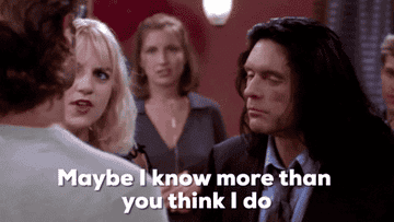 Gif of Tommy from The Room shoving someone while saying &quot;maybe I know more than you think I do&quot;