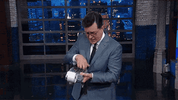 Stephen Colbert uses a calculator.