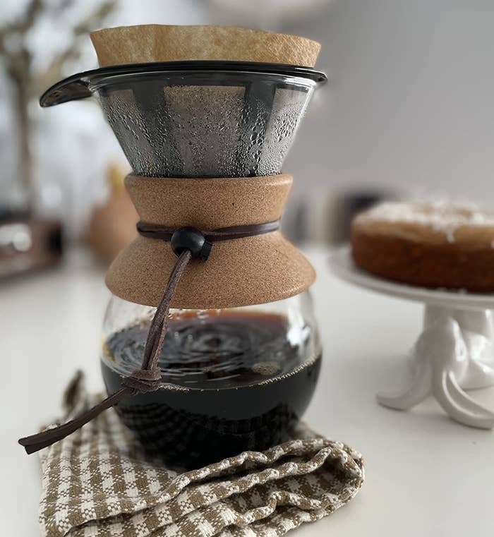 reviewer photo showing the pourover maker resting under a dishcloth 