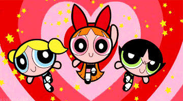 Bubbles, Blossom, and Buttercup pose in front of a heart-shaped background