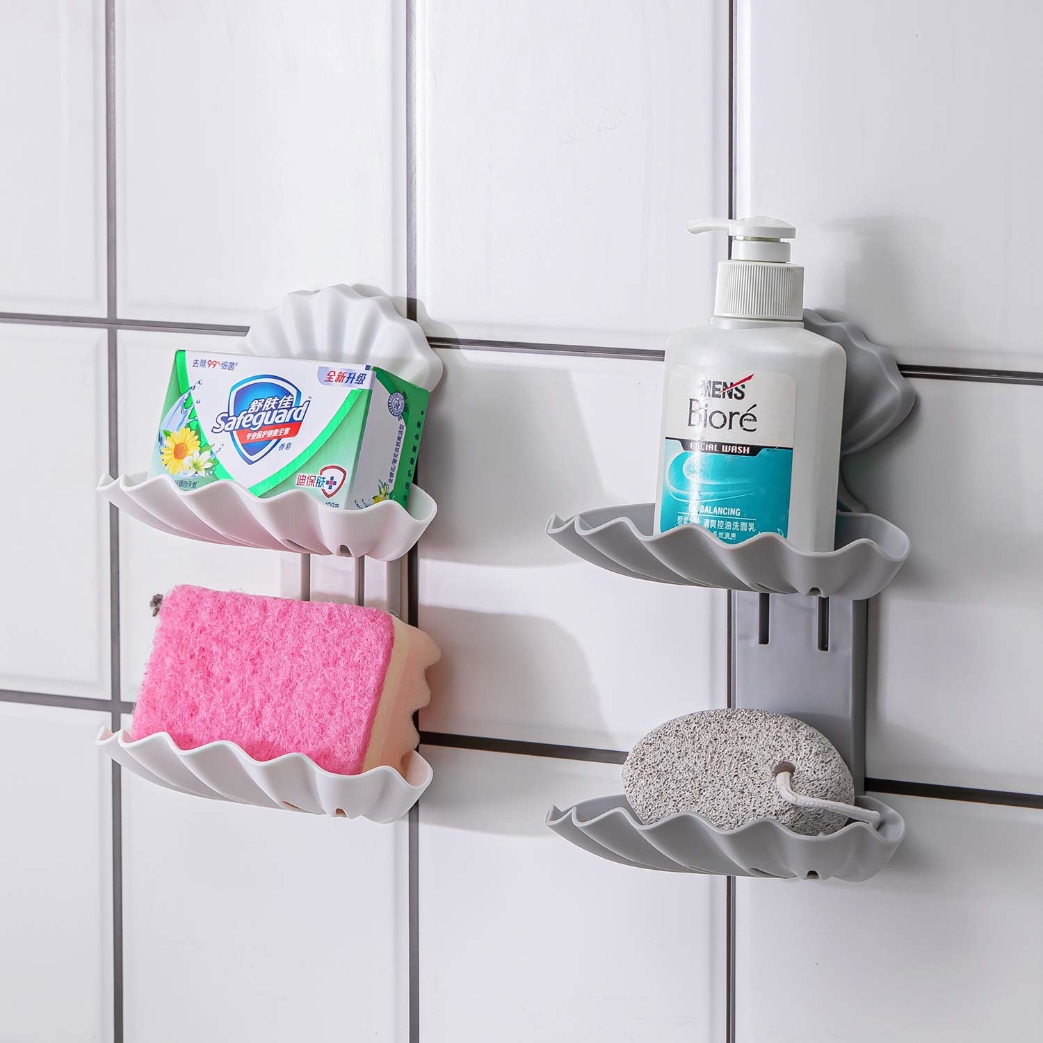 Four shell-shaped soap holders on the wall