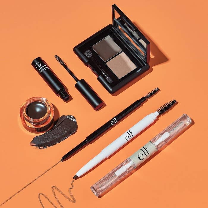 various e.l.f. makeup products against orange background