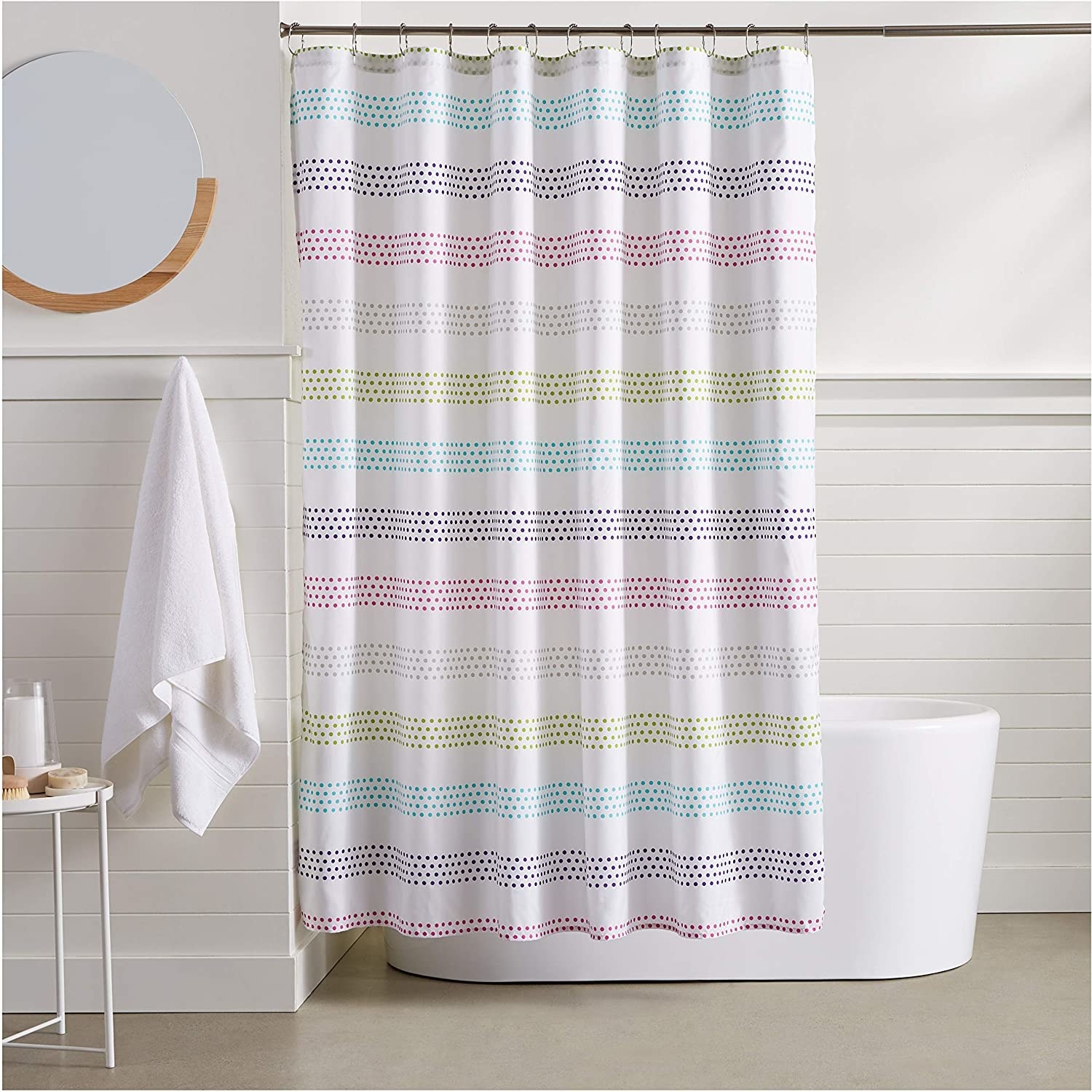 A pastel shower curtain on a curtain
